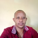 Mr. Mukono|S.T. Mukono, Simon T. Mukono